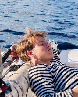 Man sleeping on a sailboat